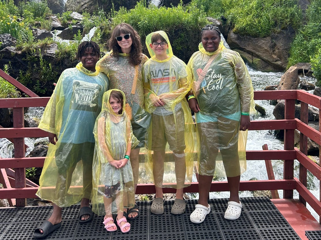 Family posing by waterfalls