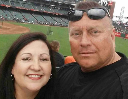Israel Trevino Jr., right, at a baseball game with an unnamed woman.