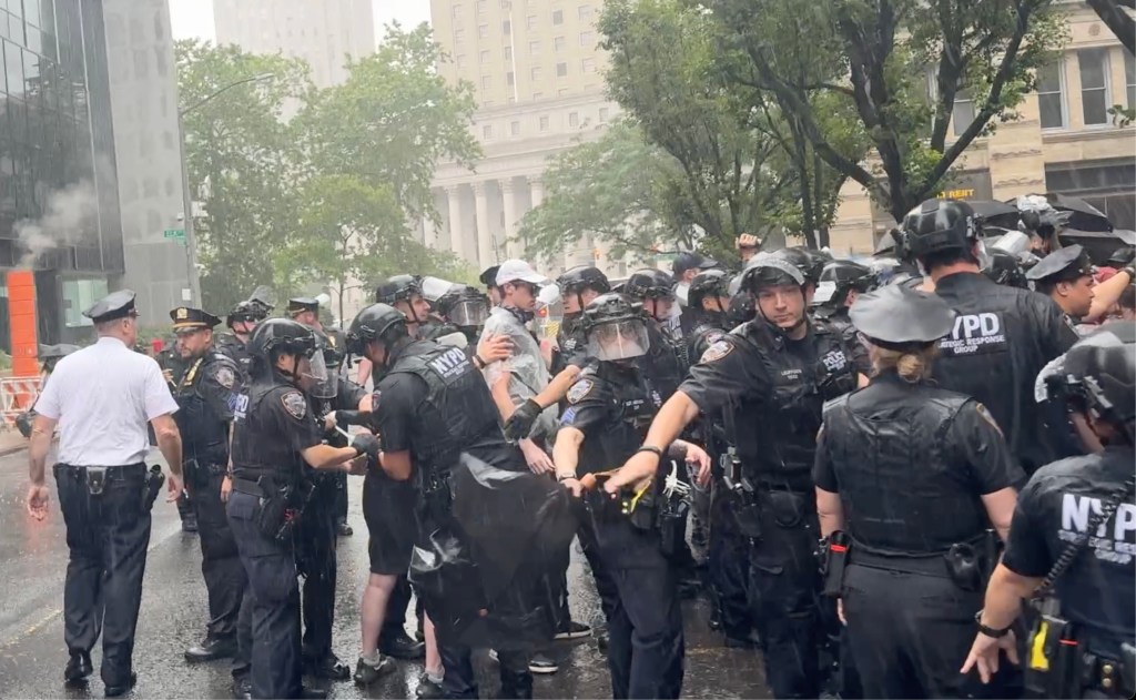NYPD officers and immigrations officers clash with protestors after they blocked the roadway in front of 26 Federal Plaza in Lower Manhattan on Saturday, June 7, 2025