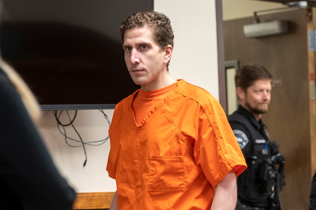 Bryan Kohberger seen in an orange jumpsuit in courtroom.