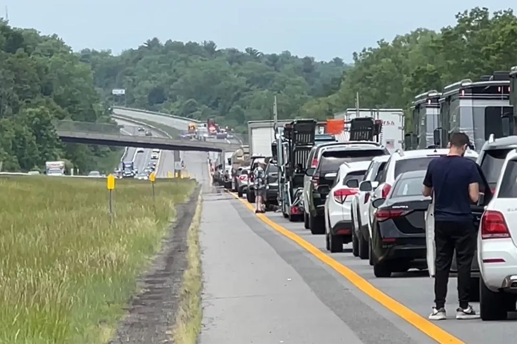 The wreck, which sent the driver and passenger involved in the traffic stop to the hospital, closed the highway for hours.
