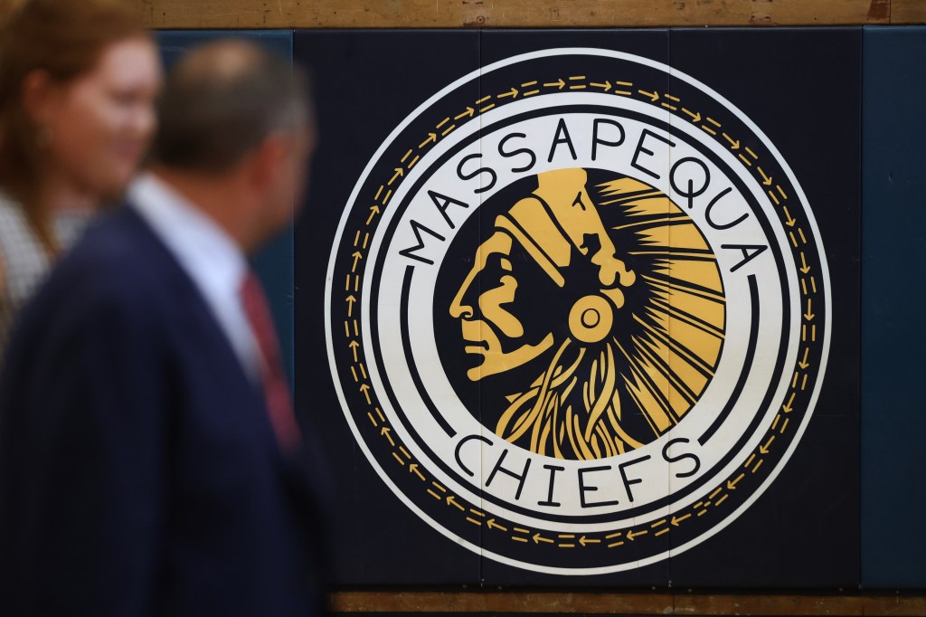 Massapequa Chiefs logo on a wall.