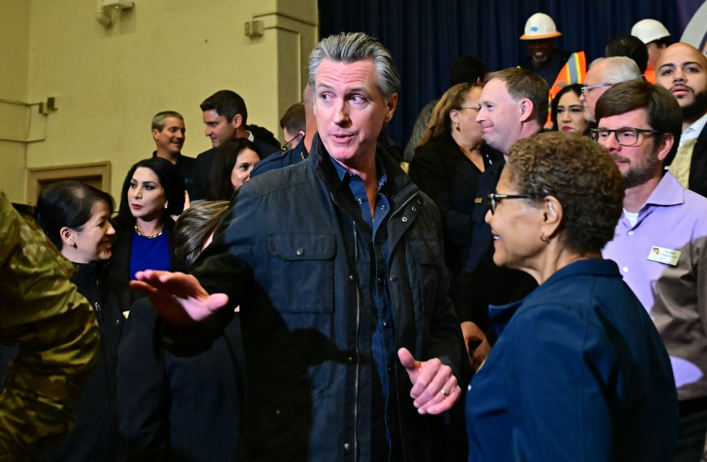 California Gov. Gavin Newsom speaks with LA Mayor Karen Bass at a press conference in Los Angeles on Jan. 23, 2025.