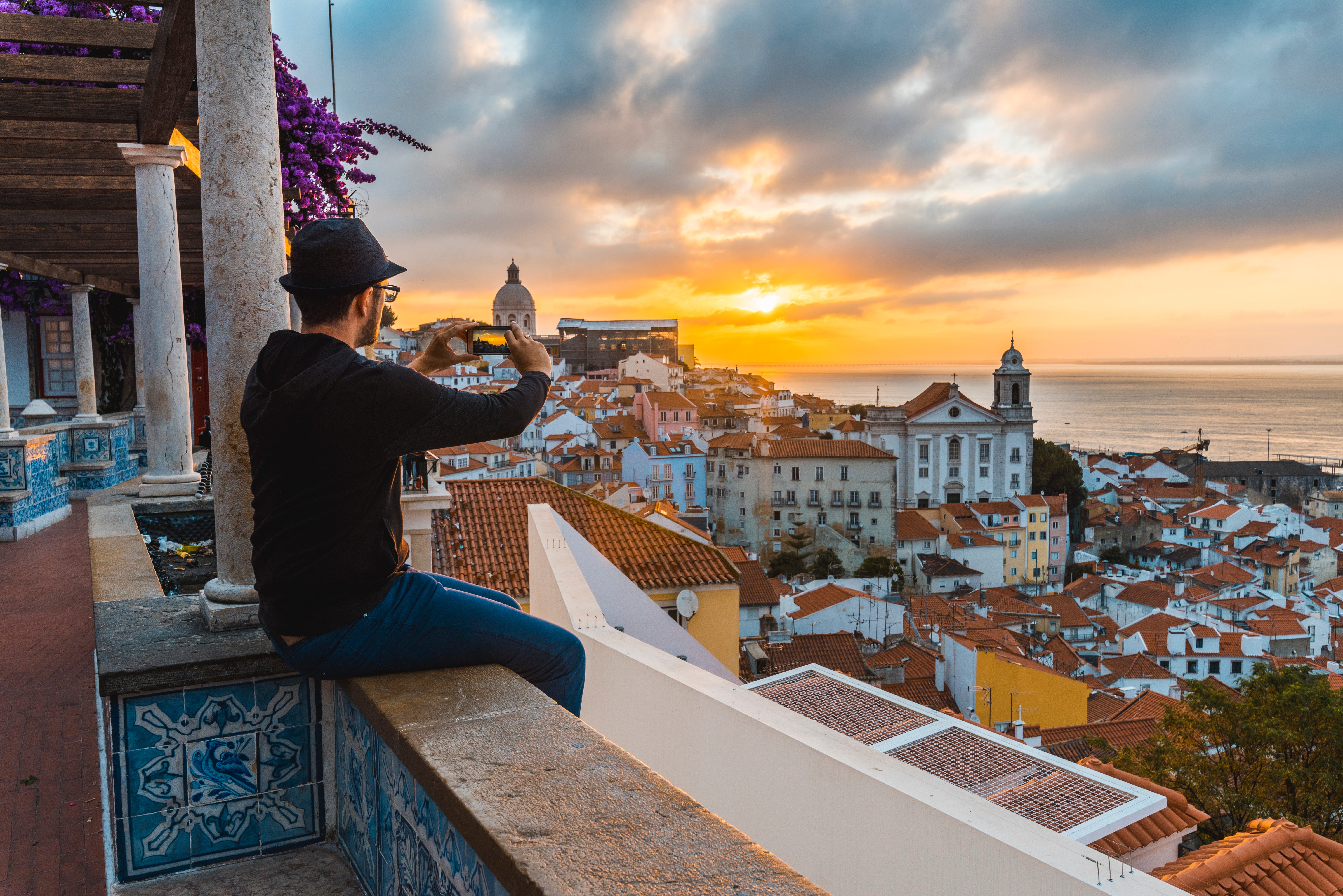 Tourist taking photo in Lisbon, Portugal.