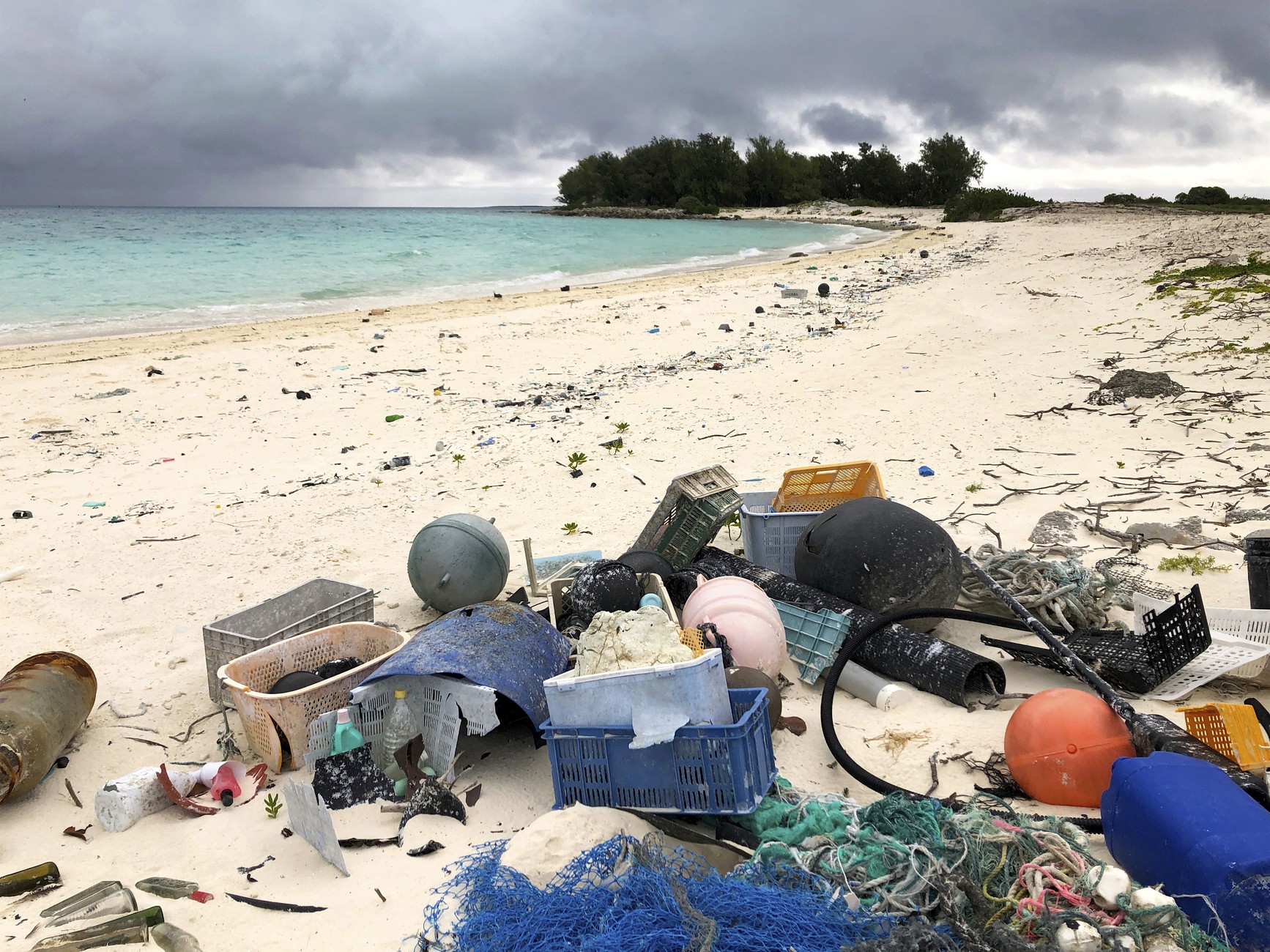 Bits of plastic and other debris, on a tropical beach