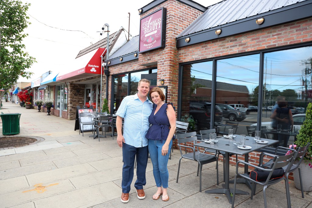 Michael and Maria Cassano, owners of American Beauty Restaurant in Massapequa Park stand outside their restaurant.