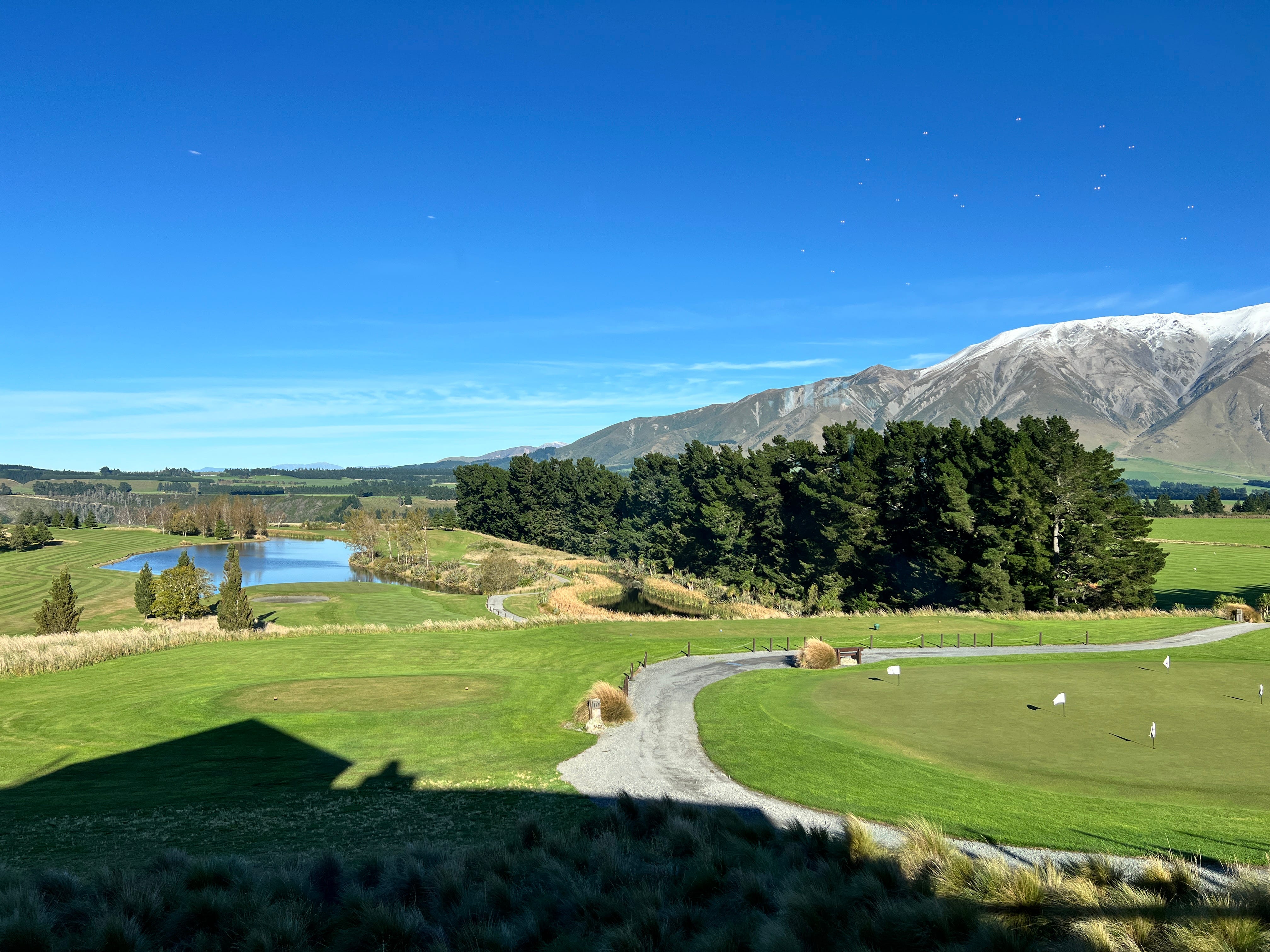 Fable Terrace Downs Resort golf course next to mountains, trees