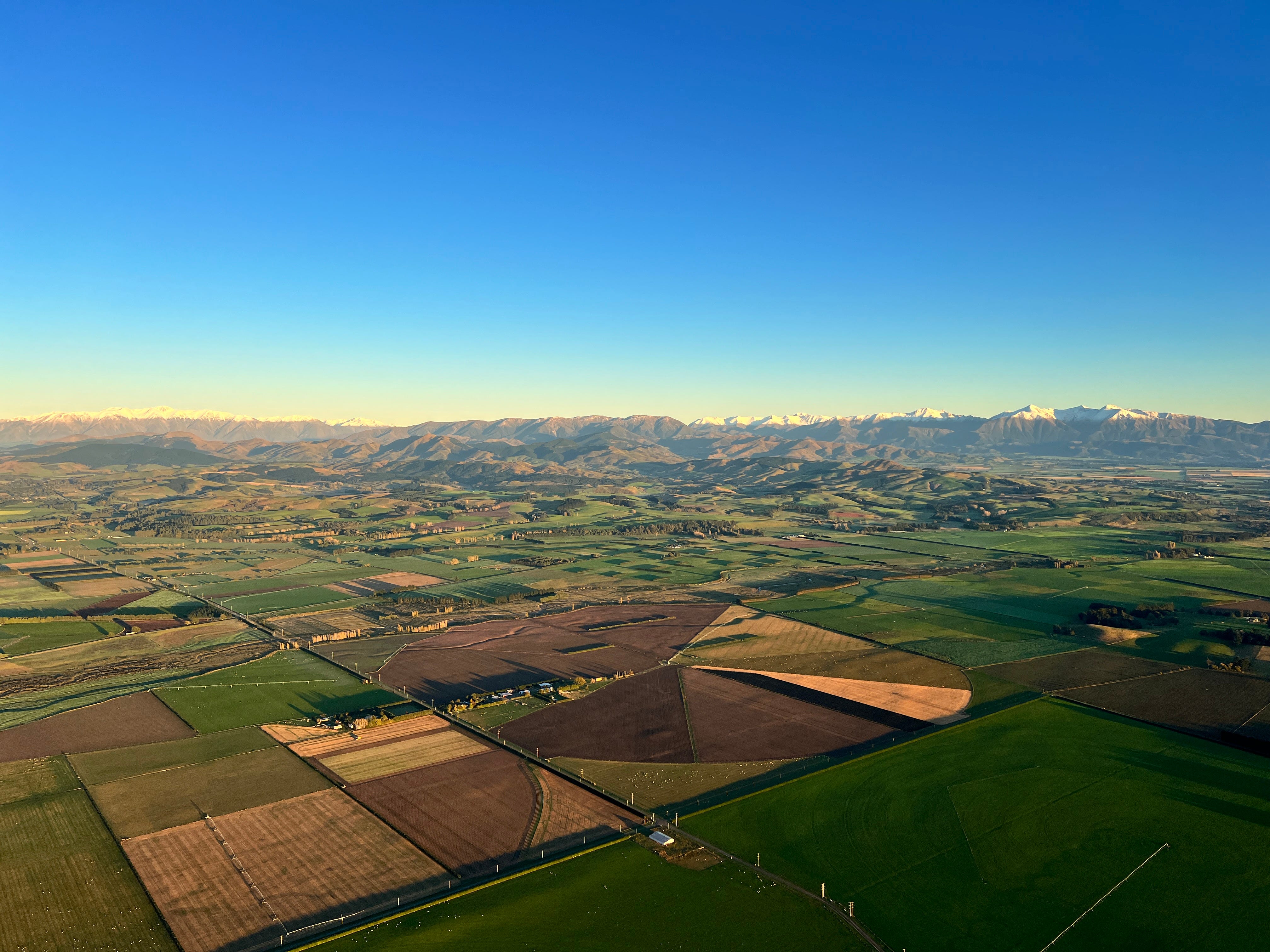 Aerial view of New Zealand fields, mountains