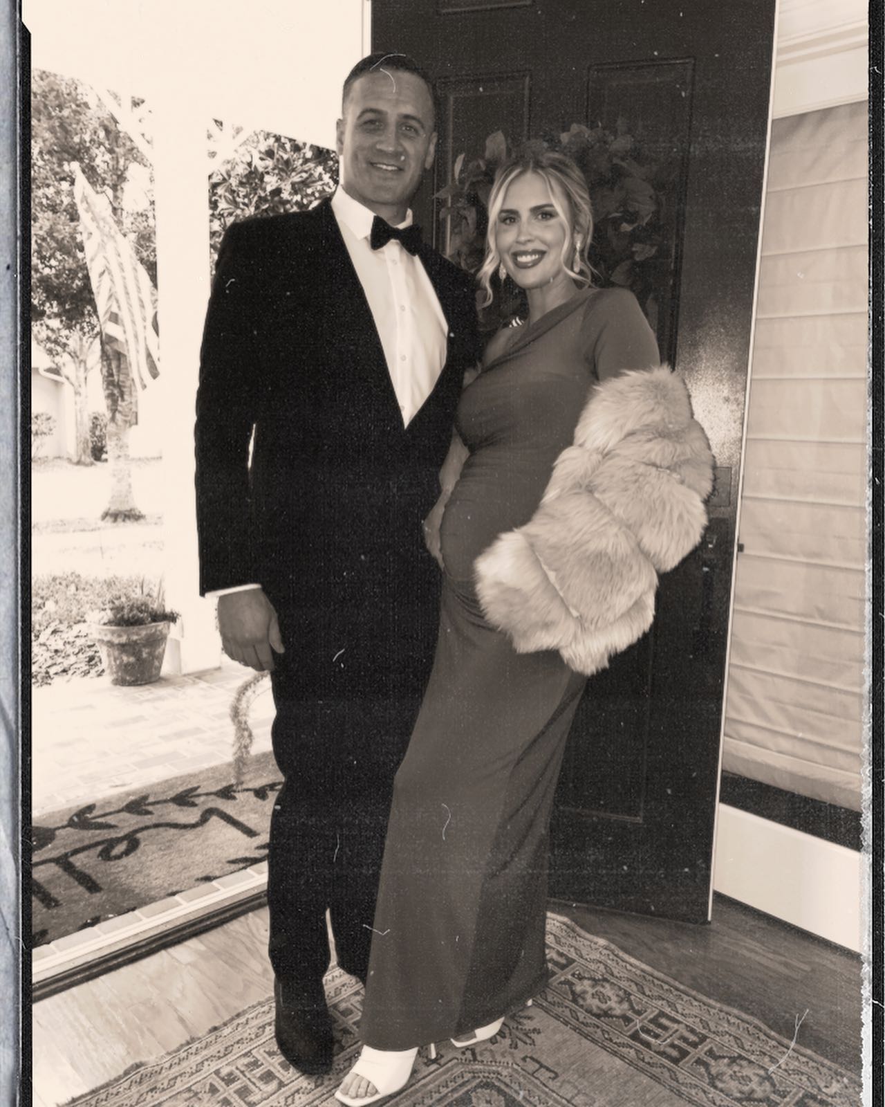 Ryan Lochte and Kayla Reid pose for a photo.