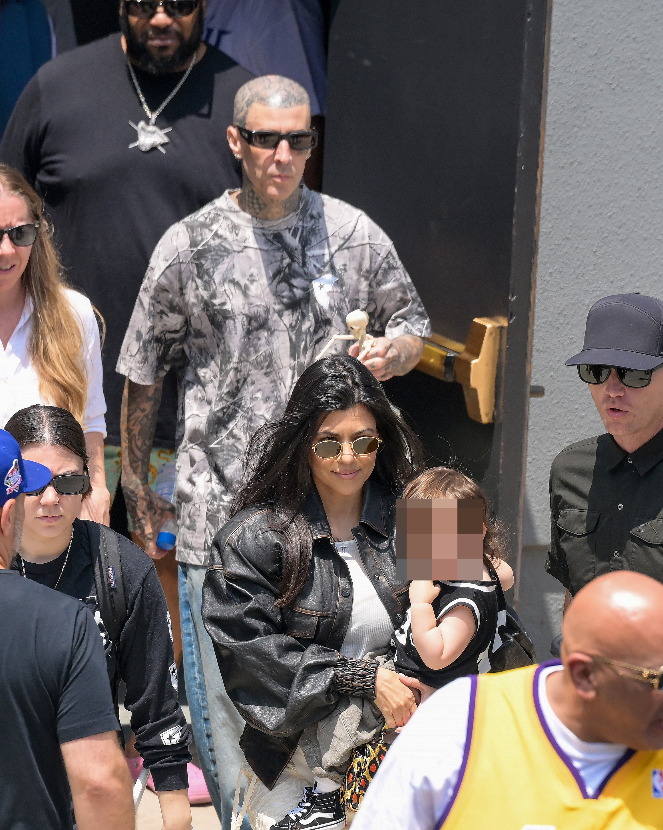 Kourtney Kardashian and Travis Barker take their son Rocky to his first public event as Travis gets a street named after him in Fontana.