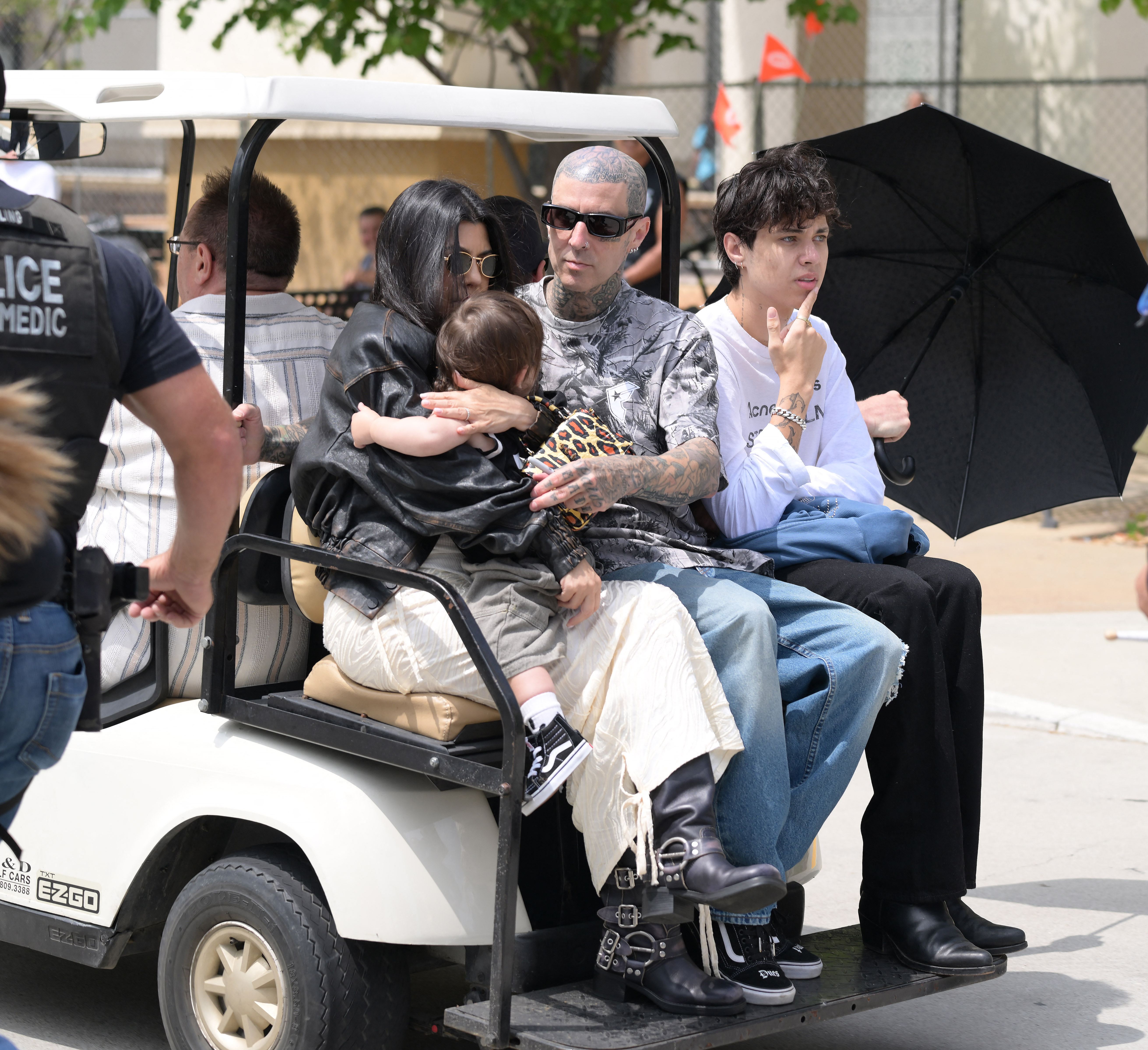 Kourtney Kardashian and Travis Barker take their son Rocky to his first public event as Travis gets a street named after him in Fontana.