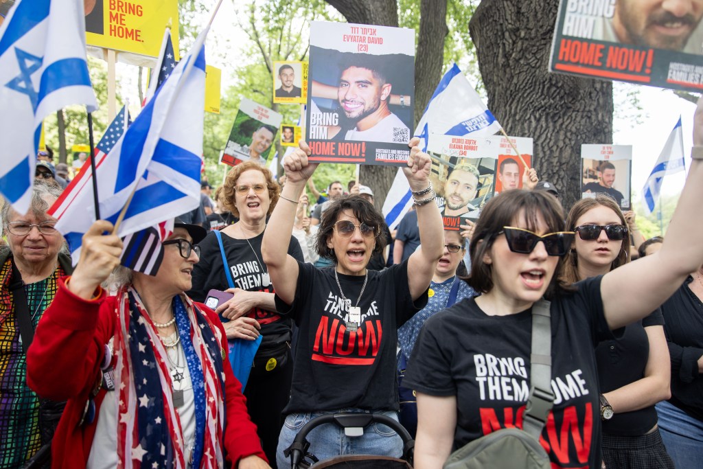 Protestors at a rally in Central Park demand the release of hostages.
