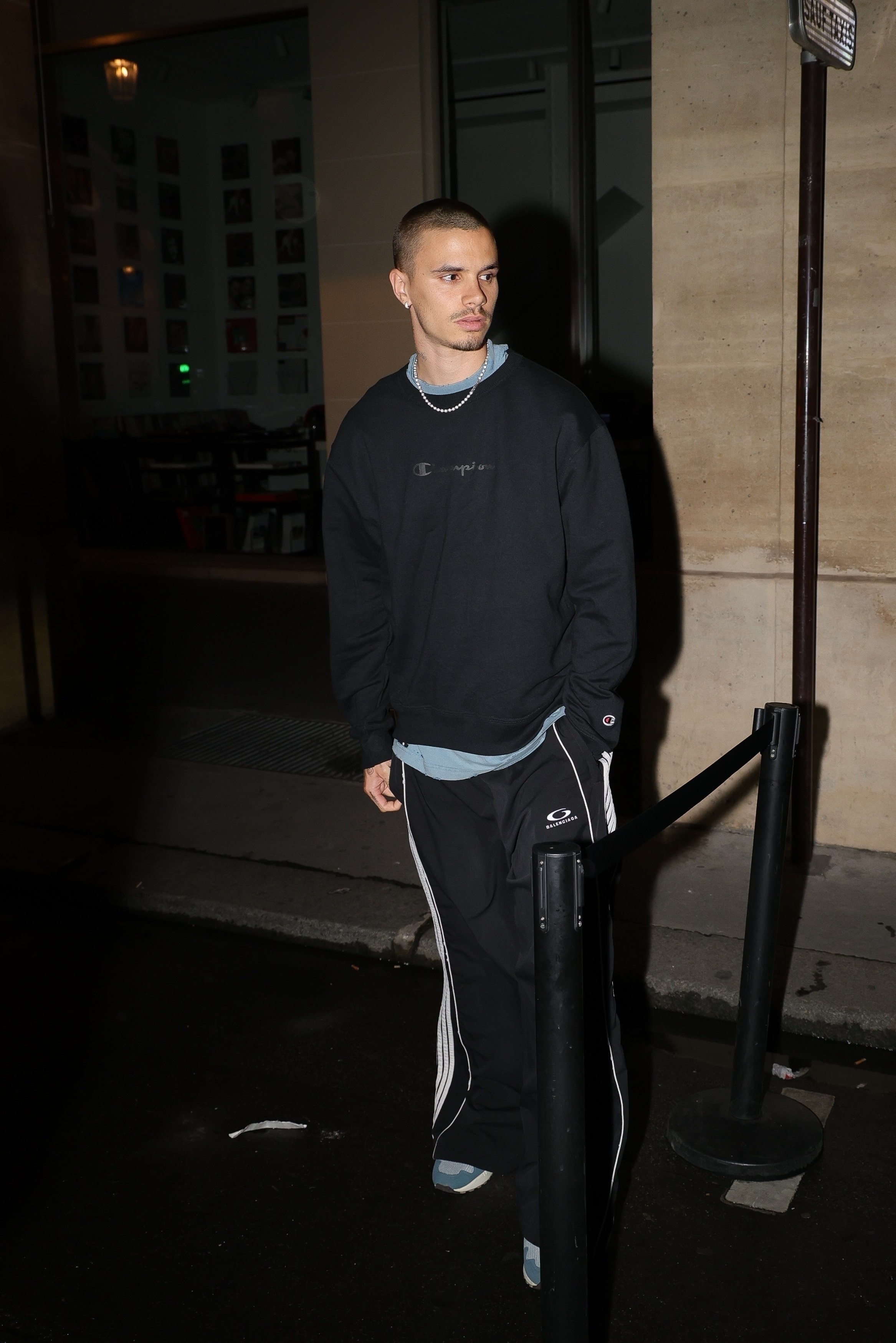 Romeo Beckham outside of a club in Paris.