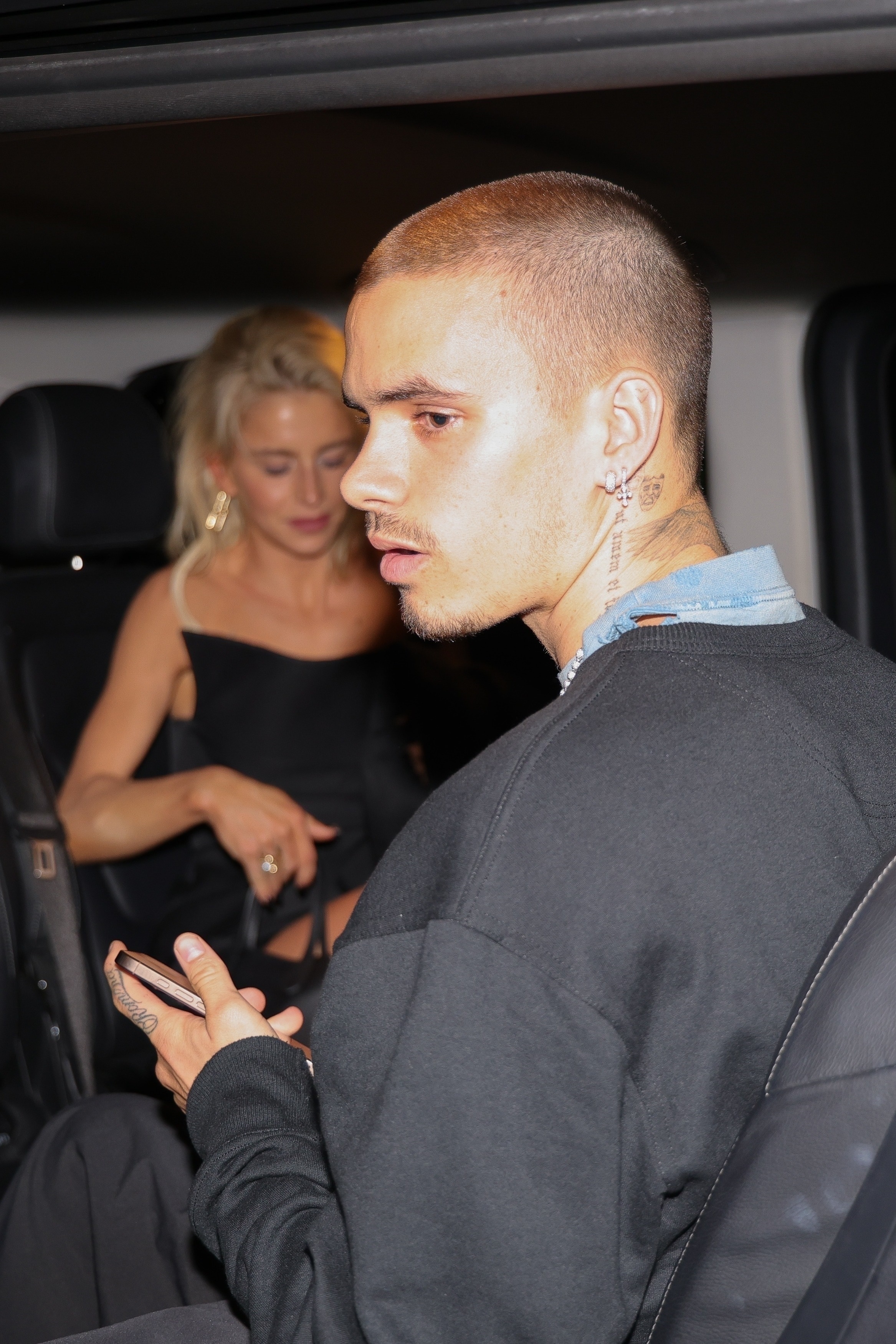 Romeo Beckham and Caroline Daur leave a night club in Paris.