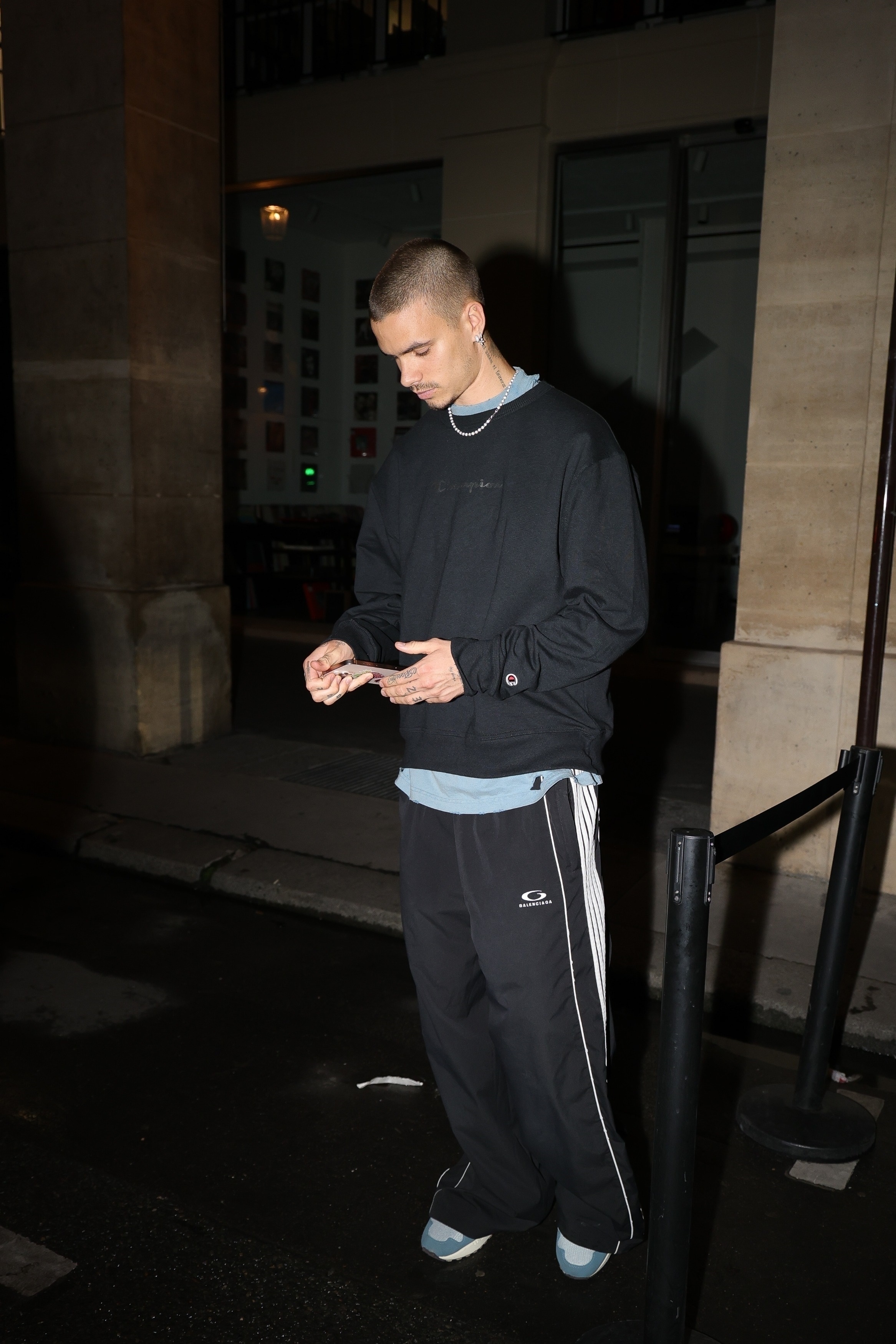 Romeo Beckham outside of a club in Paris.