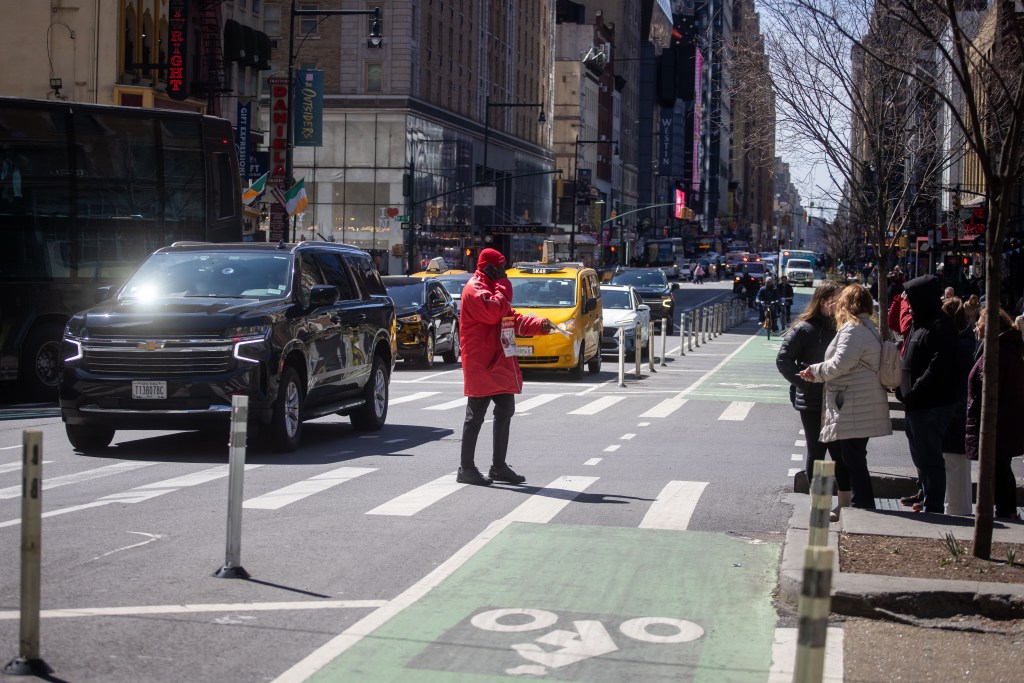 Person jaywalking in Midtown, NYC.