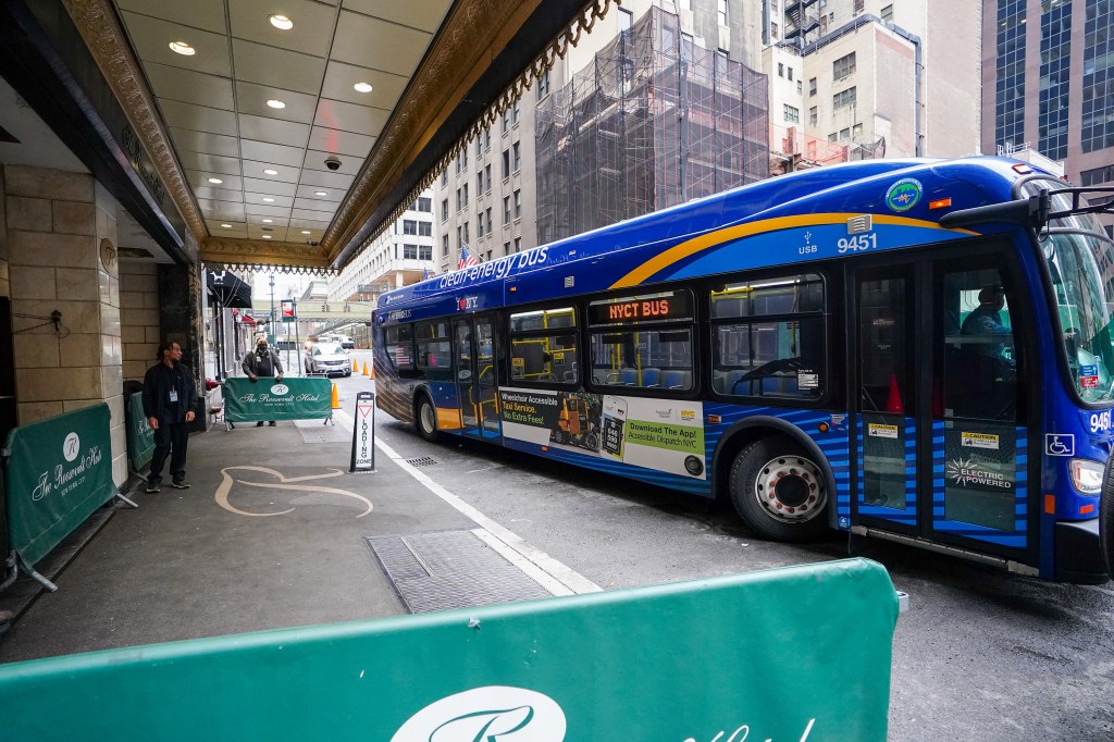 Asylum seekers arriving at the Roosevelt Hotel via MTA bus.
