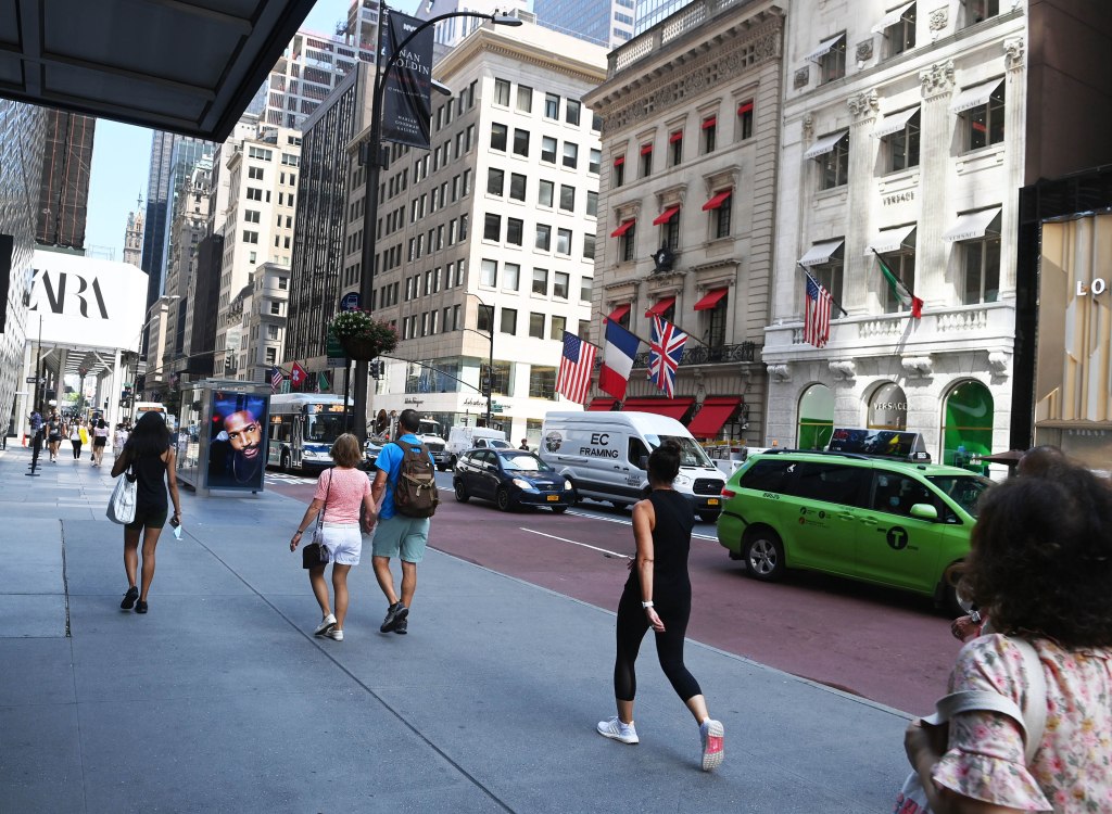 Pedestrians walking on Fifth Avenue in Midtown, New York City.