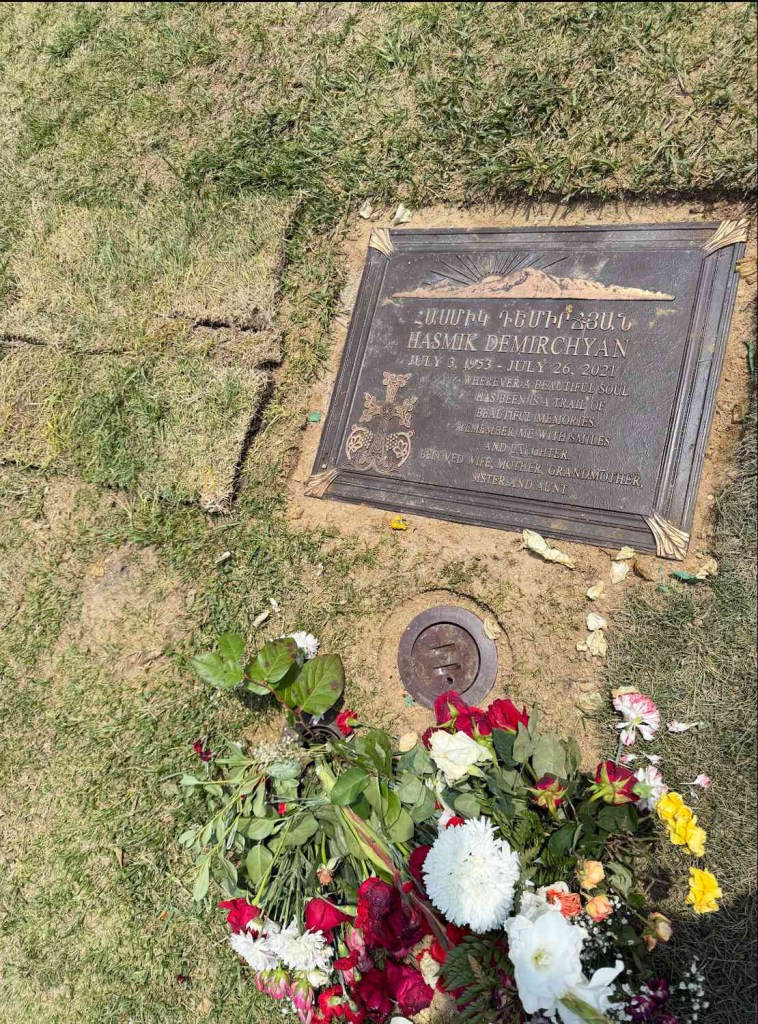 Headstone for Hasmik Demirchyan (1953-2021) with flowers.
