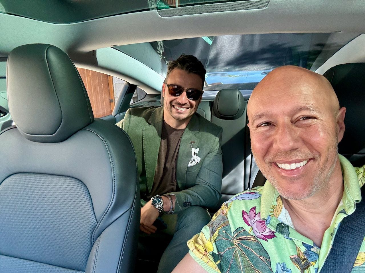 David Risher poses for a selfie as a Lyft driver