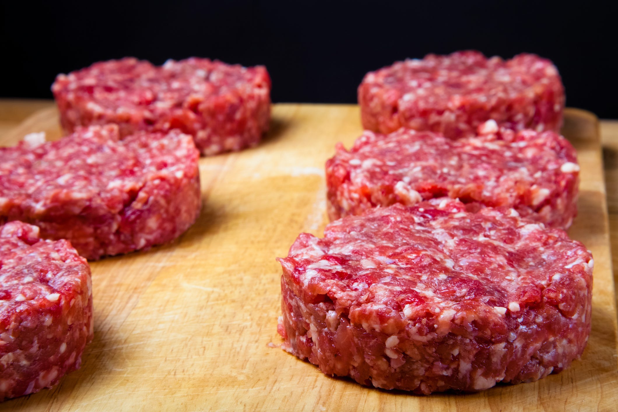 ground beef raw burger patties cooking meat