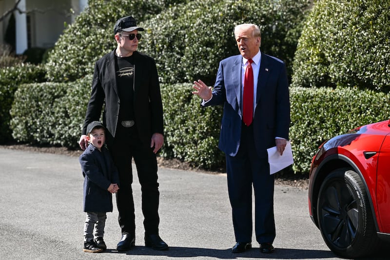 President Donald Trump and Elon Musk, alongside Musk's son X Æ A-Xii, speak to the press on the South Portico of the White House on March 11, 2025 in Washington, D.C.