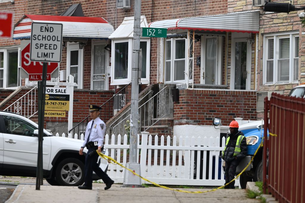 NYPD officers at the scene of a home invasion and robbery in Queens, New York.