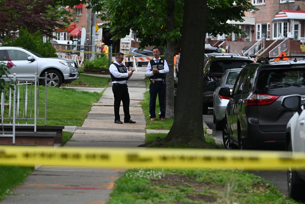 NYPD officers at the scene of a home invasion and robbery in Queens, New York.