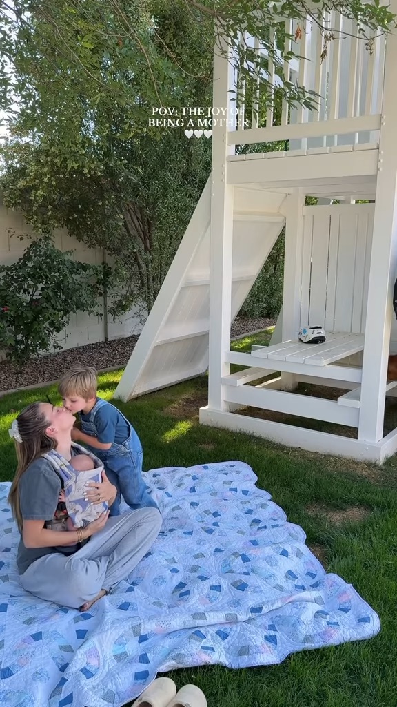 TikTok influencer Emilie Kiser kisses son.