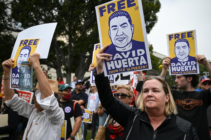 Demonstrators rally against US Immigration and Customs Enforcement (ICE) and call for the release of union leader David Huerta, President of SEIU California and SEIU-USWW, who was arrested on June 6 during federal immigration operations, at Gloria Molina Grand Park in Los Angeles, on June 9, 2025.