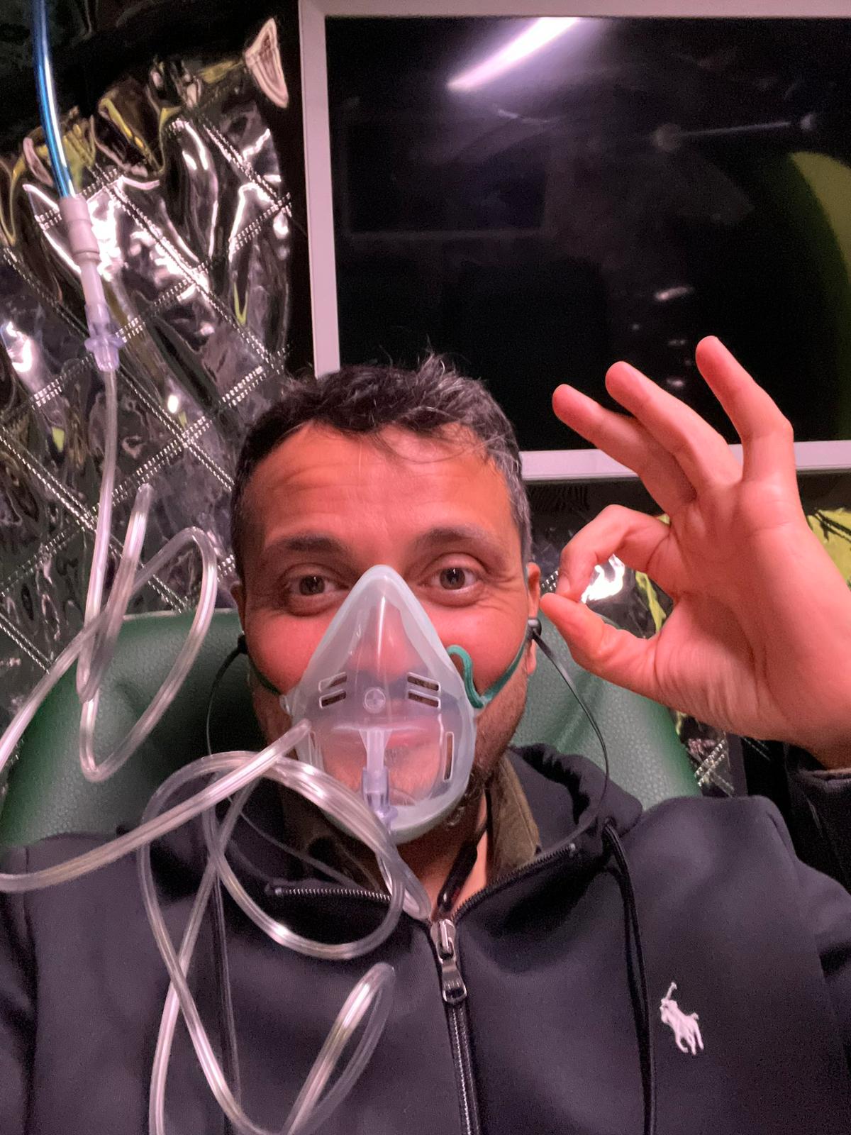A man wearing an oxygen mask.