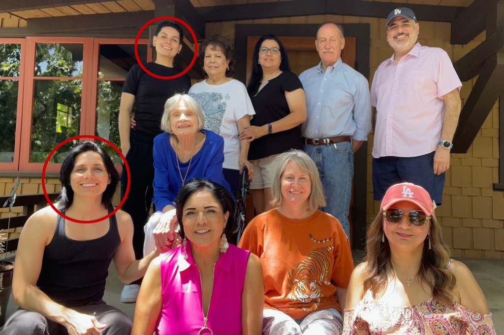 Group photo of a family on a porch.