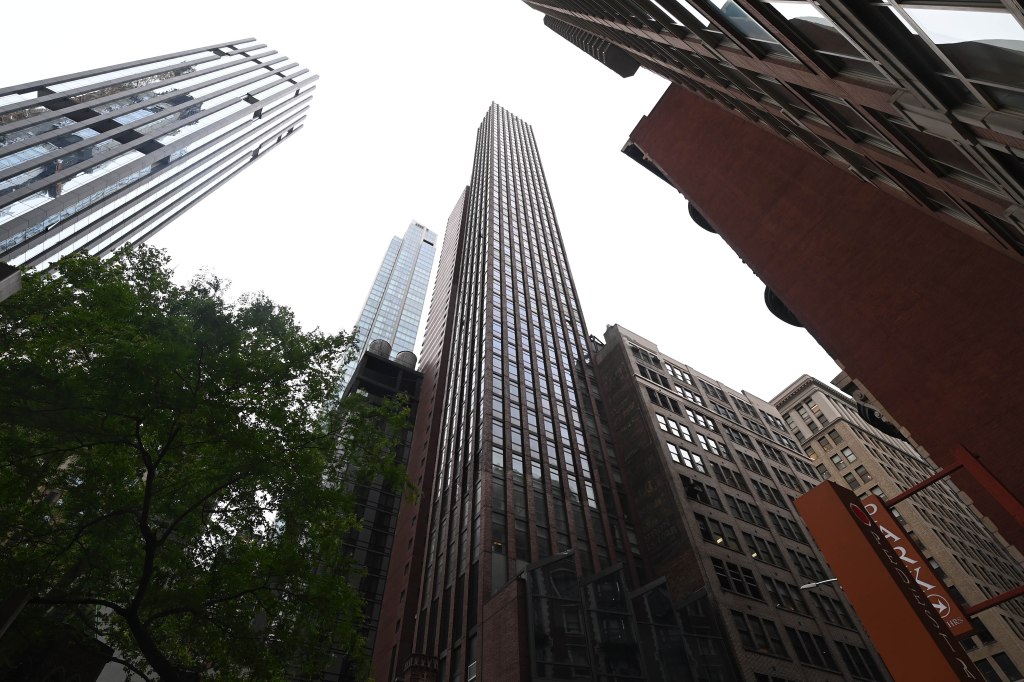 Low-angle view of several New York City skyscrapers.