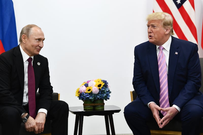 U.S. President Donald Trump (R) attends a meeting with Russian President Vladimir Putin during the G20 summit in Osaka on June 28, 2019.