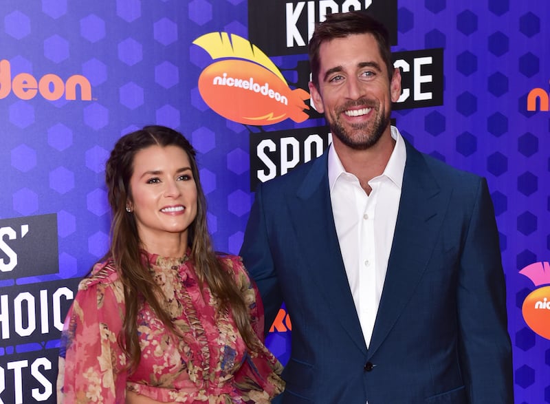 Danica Patrick (L) and Aaron Rodgers (R)