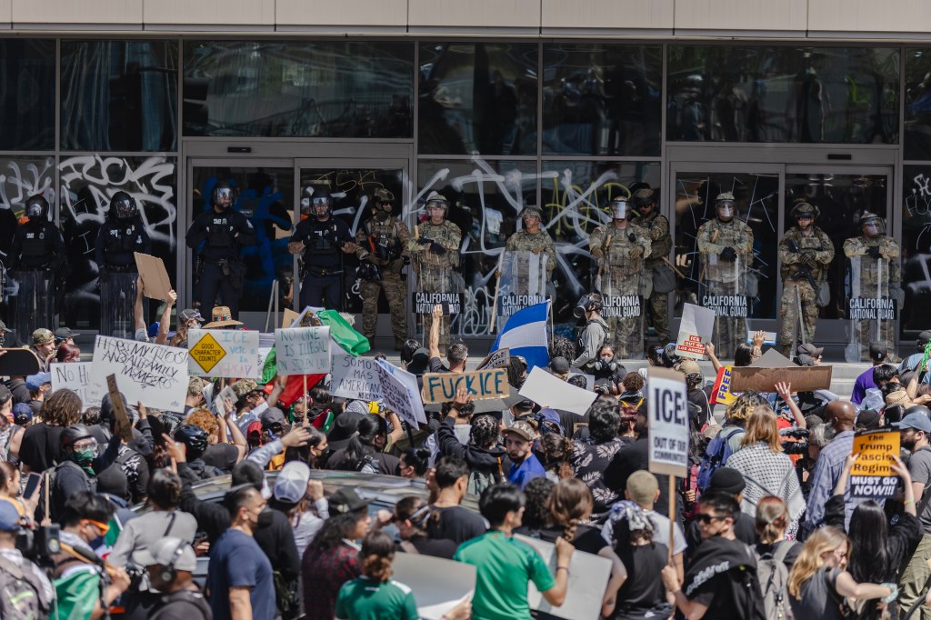 Protestors demonstrating against federal immigration raids.