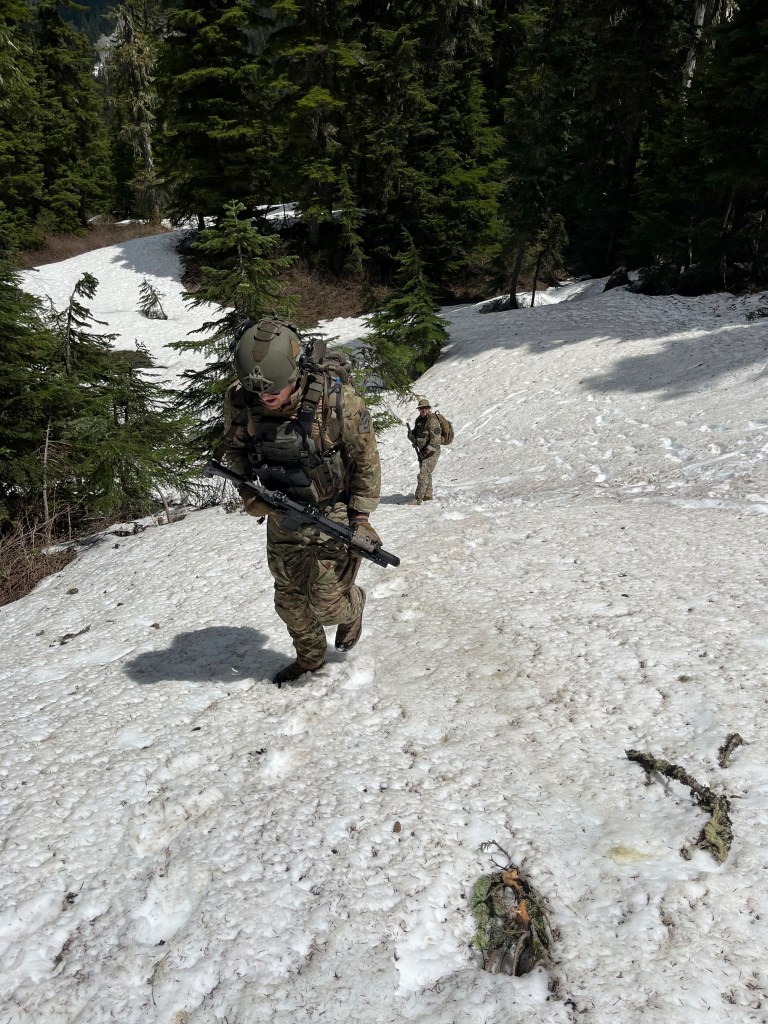Deputies searching snowy terrain.