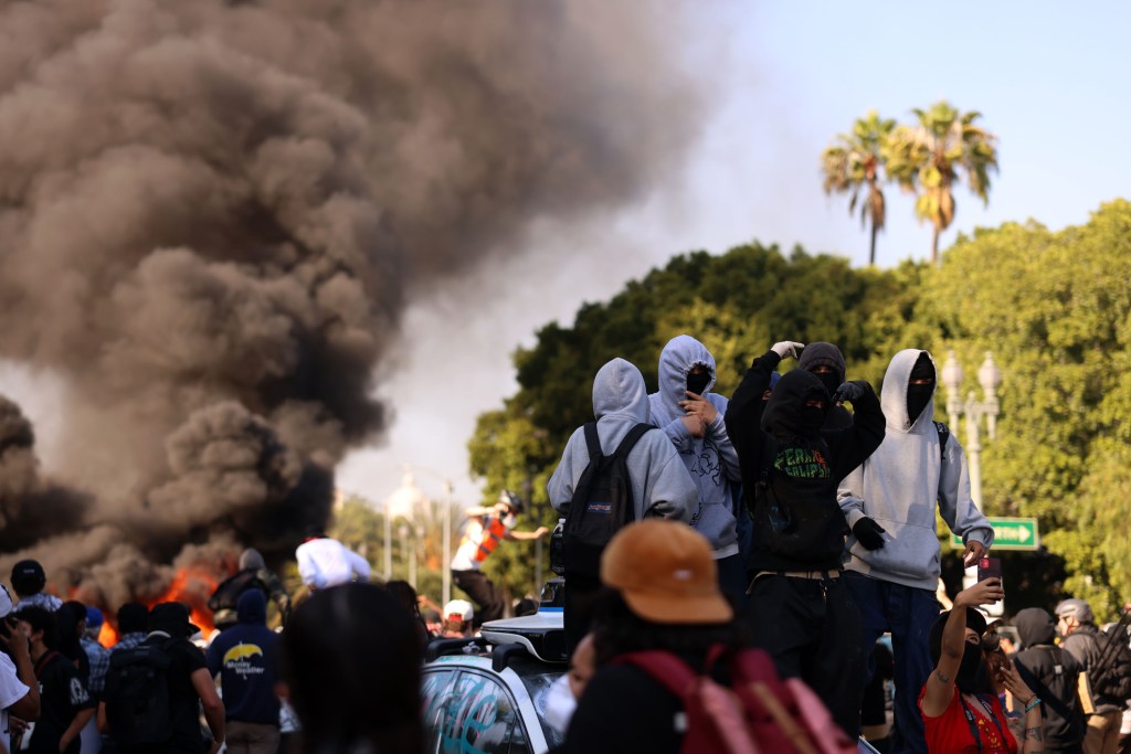 Vehicles are being torched and the freeway was shut down by protestors.