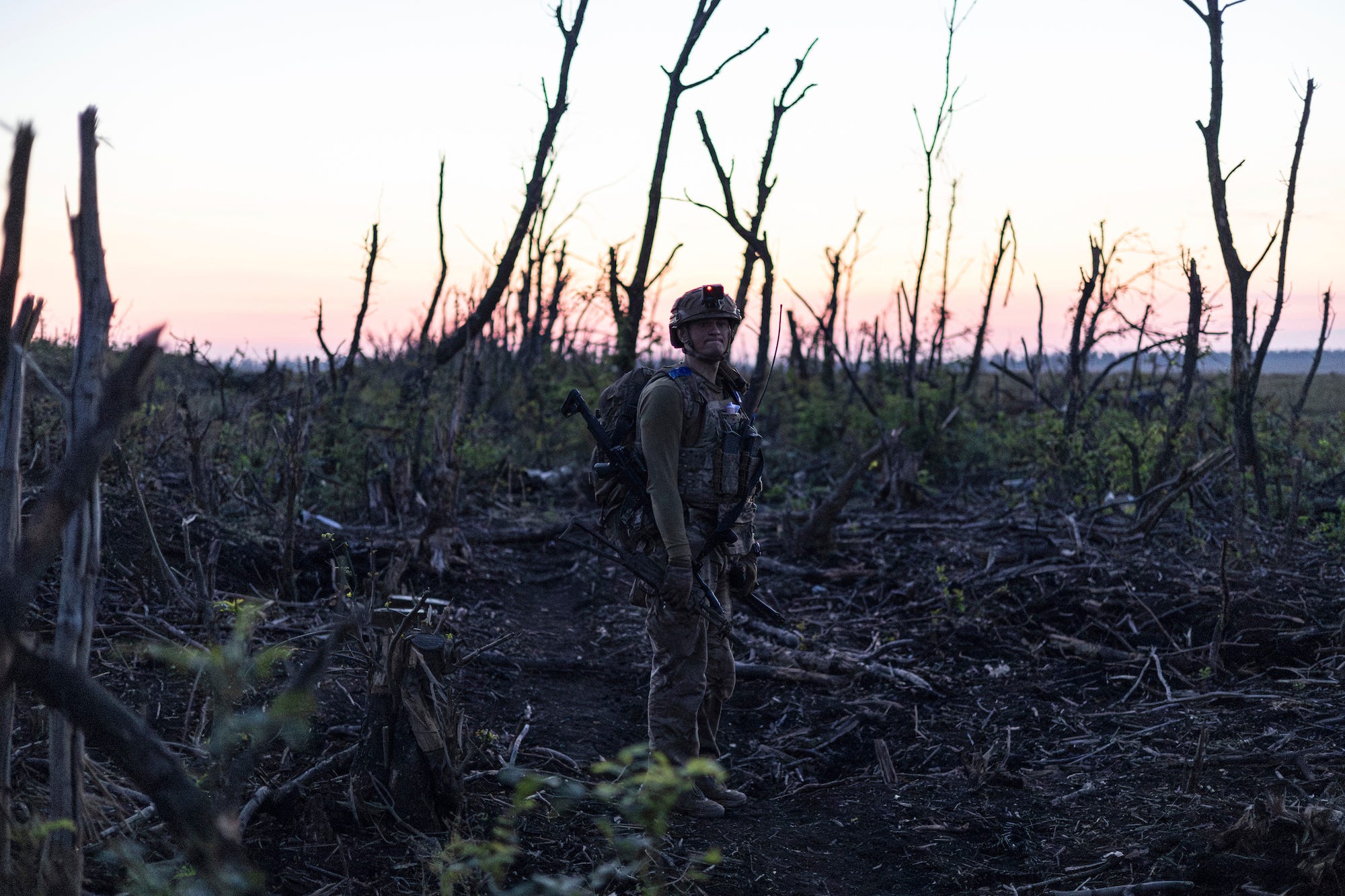 Assault unit commander from 3rd Assault Brigade who goes by the call sign 'Fedia' listens to explosions at the frontline a few kilometers from Andriivka, Donetsk region, Ukraine,