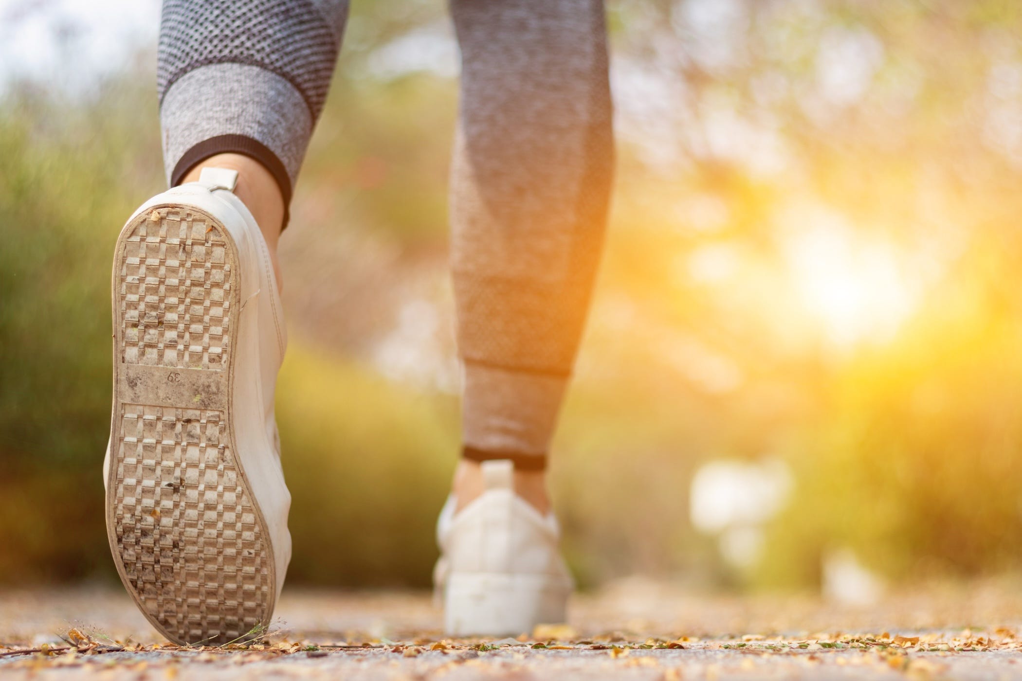 brisk walking person, foot and leg view