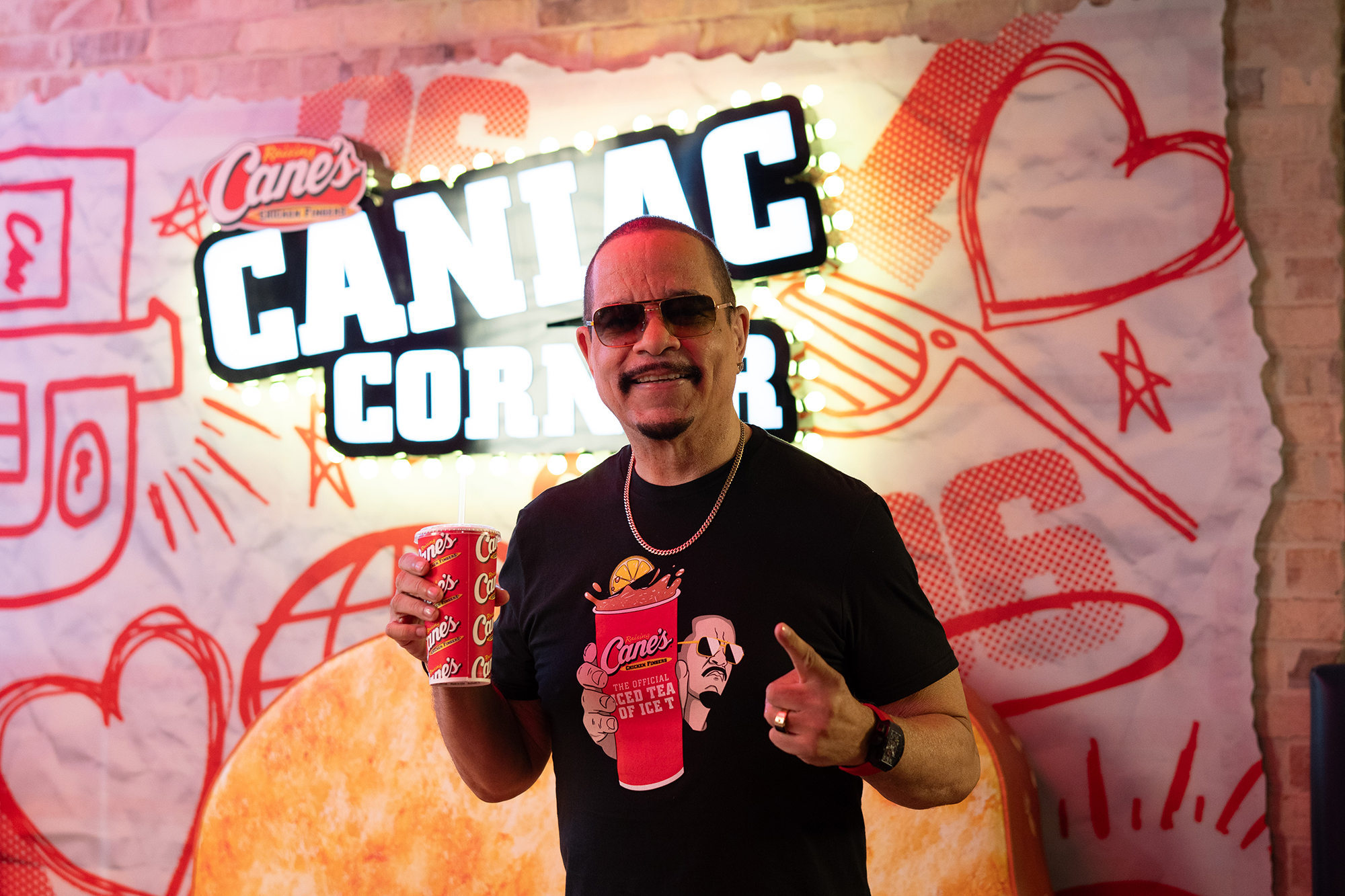 Ice T drinks to that with Raising Cane’s iced tea in hand celebrating National Iced Tea Day at Raising Cane’s Global Flagship in Times Square on Tuesday, June 10, 2025.