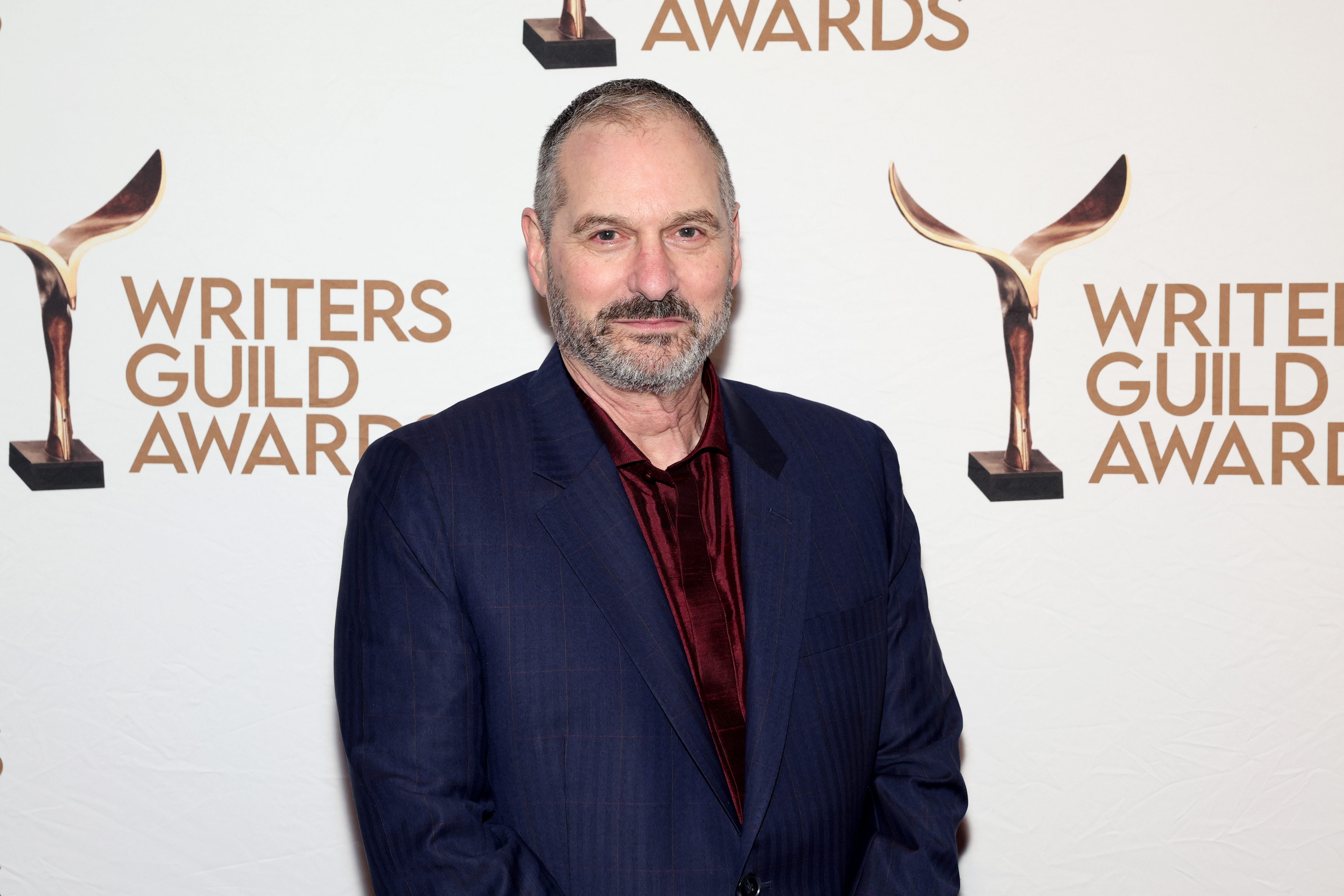 Scott Frank stands at an awards ceremony
