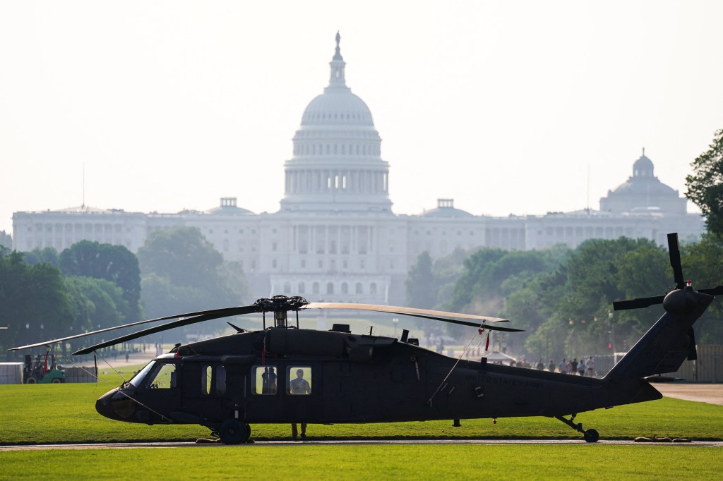 Black Hawk helicopter on the National Mall with the U.S. Capitol in the background.
