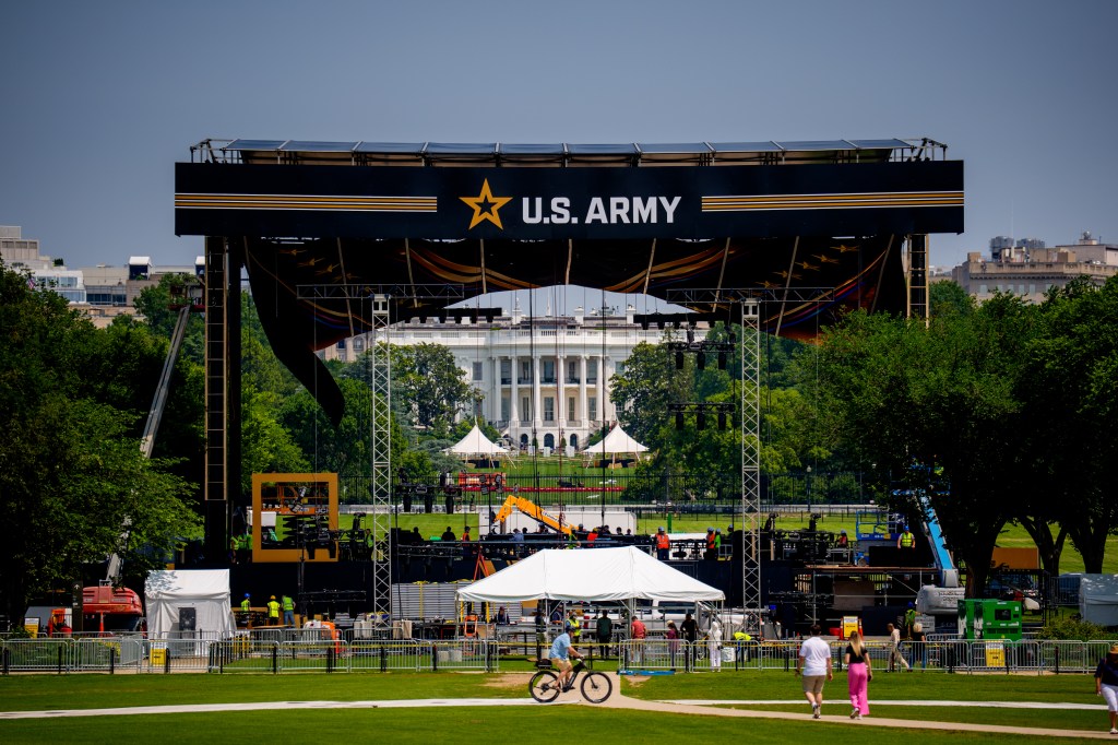 A stage with a U.S. Army banner is being set up in front of the White House.