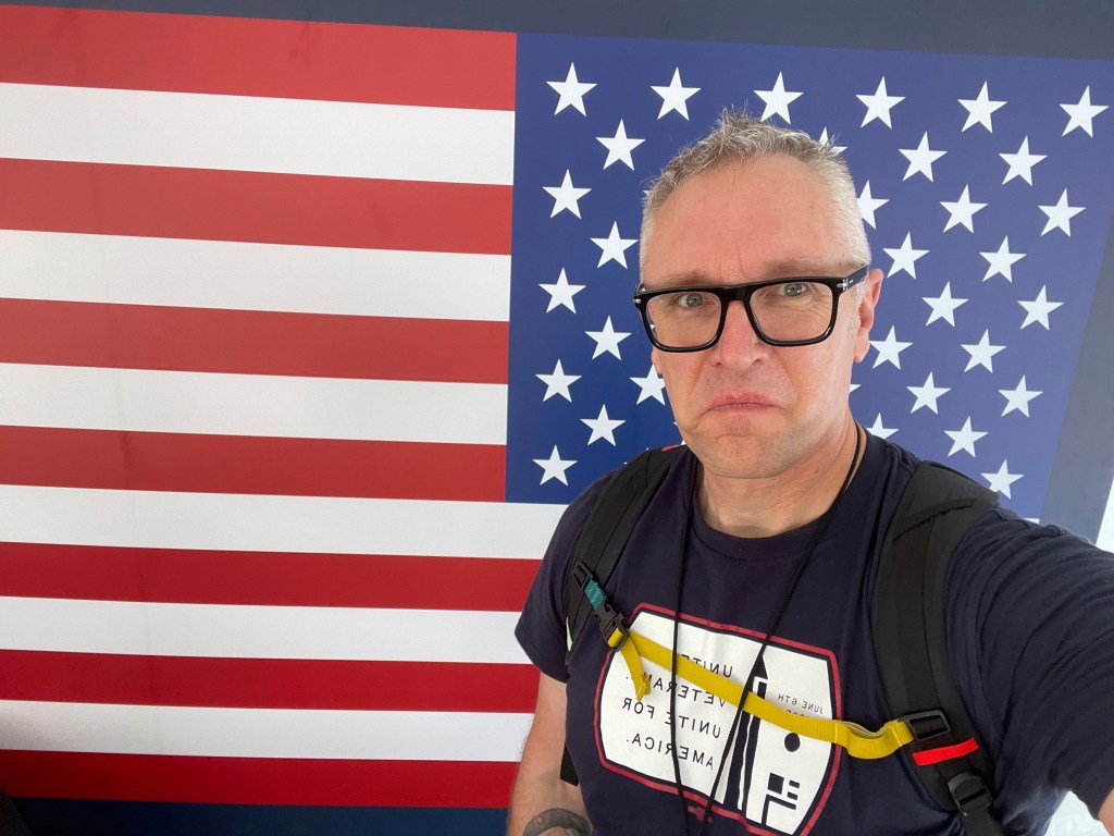 A U.S. Marine Corps veteran at a Unite For Veterans Coalition protest.