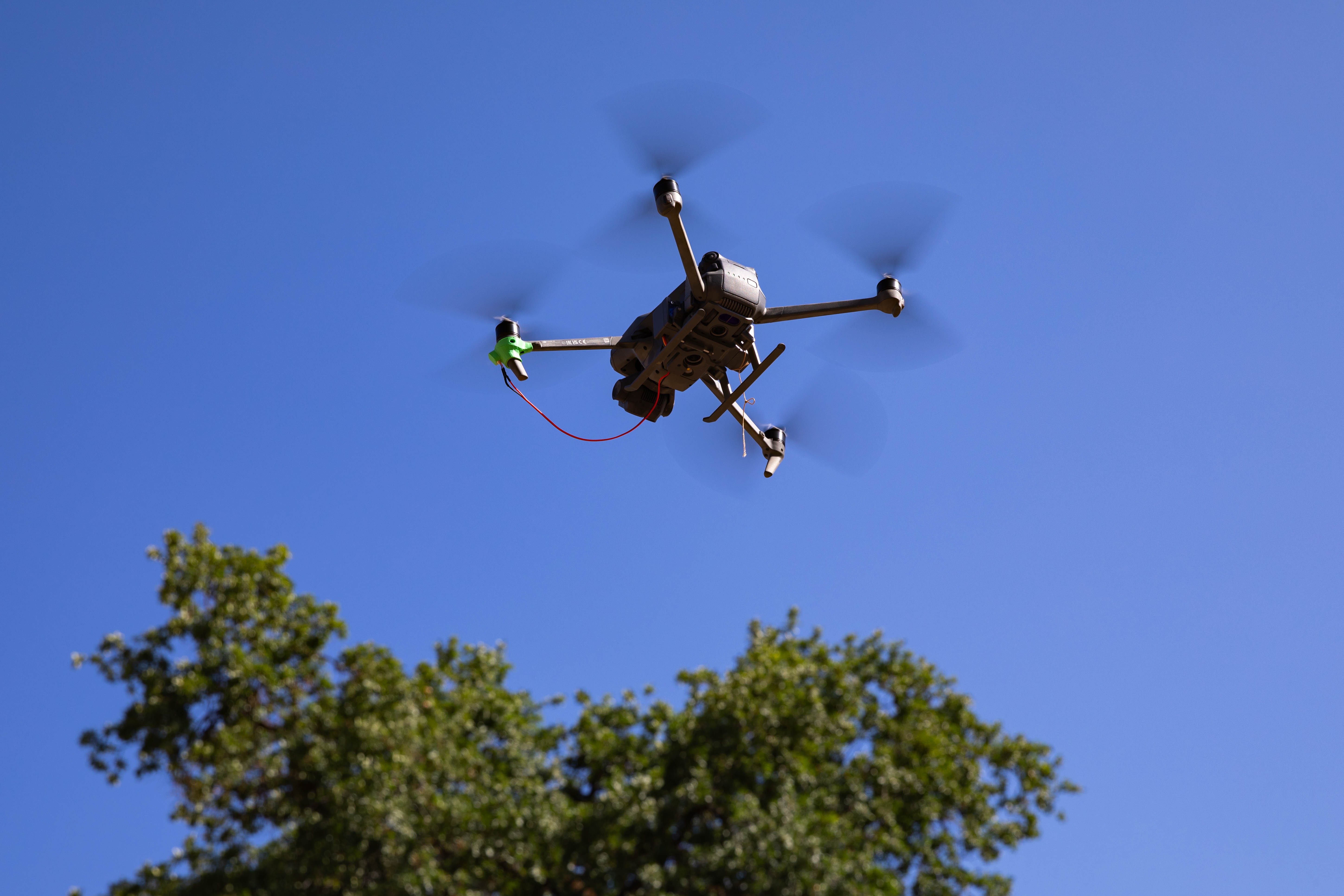 A drone flies over a field at Fort Hunter Liggett, California on May 31, 2025.