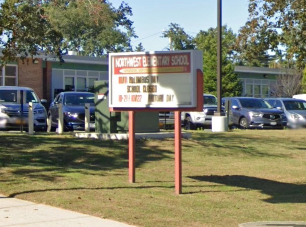 The district released a statement saying the employee was reassigned and it was investigating the incident.