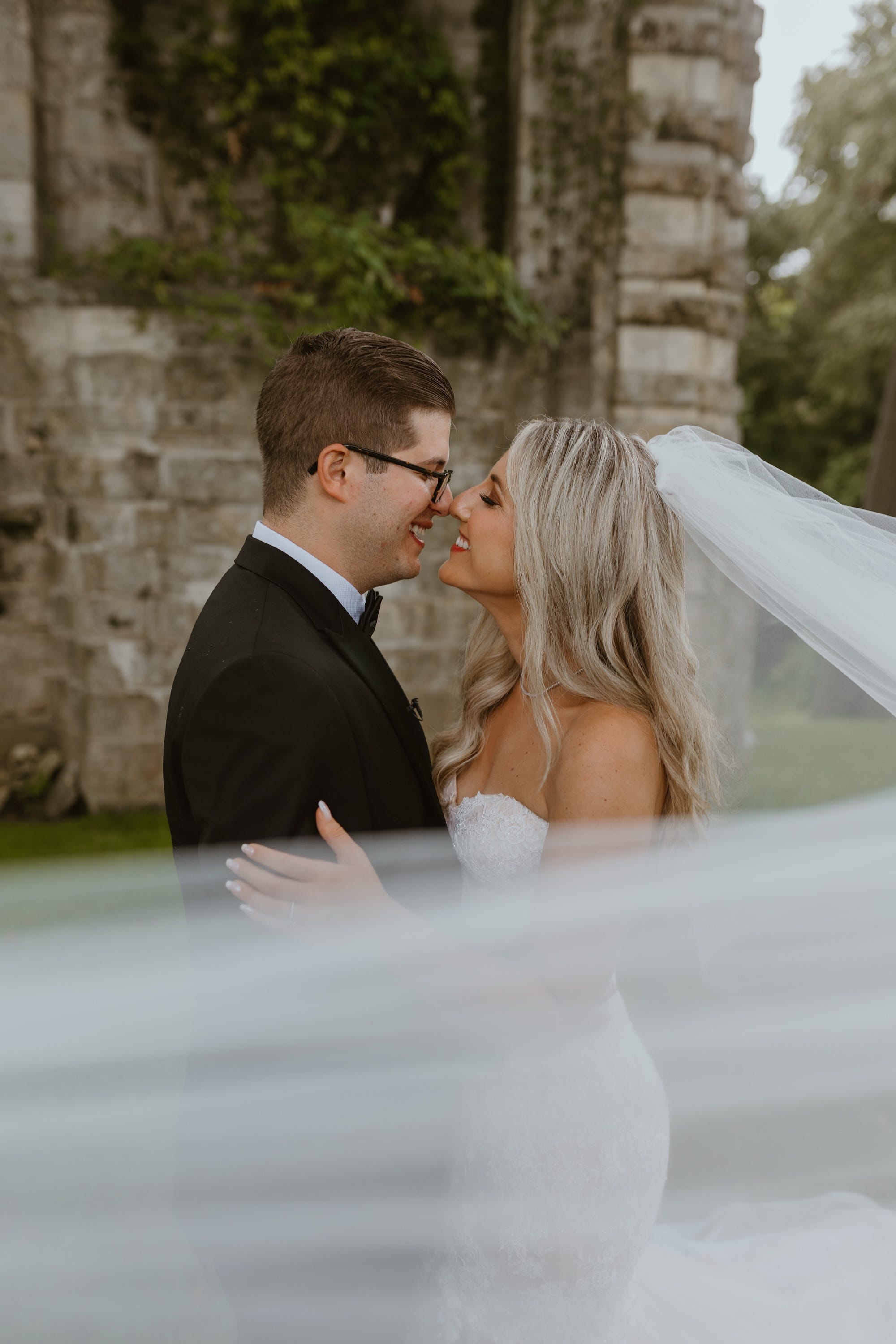 Andrew Woolf and Marielle Woolf embrace on their wedding day.