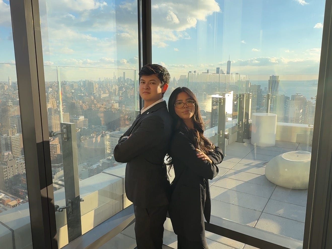 Donald King and business partner in a skyscraper overlooking New York.