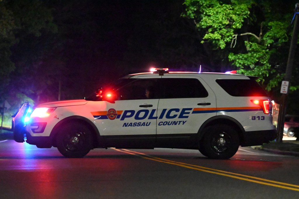 Nassau County police vehicle at night.